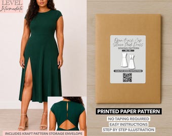 May include: A woman wearing a dark green cap-sleeve dress with a high slit. The image also shows a brown paper pattern envelope with a label that reads "Open Back Cap Sleeve Midi Dress Sewing Pattern". The text "Printed Paper Pattern" is also visible.
