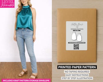 May include: A woman wearing a teal halter top and blue jeans. A brown paper pattern envelope with a label that says "Halter Neck Top Sewing Pattern" is on the right. The pattern includes a kraft pattern storage envelope.