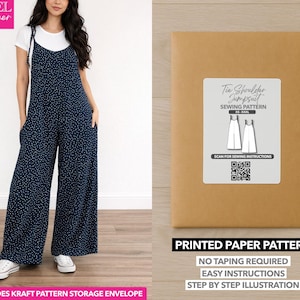 May include: A woman wearing a navy blue jumpsuit with white polka dots, paired with a white t-shirt. The image also shows a brown paper pattern envelope with the text "Tie Shoulder Jumpsuit Sewing Pattern". The text "Printed Paper Pattern" is also visible.