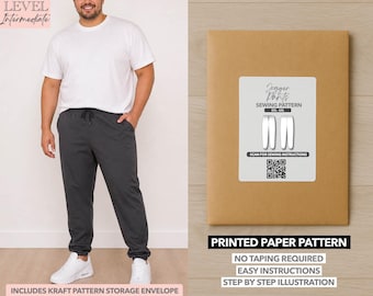 May include: A person wearing a white t-shirt and dark gray joggers. A brown paper pattern envelope with a white label that reads "Jogger Pants Sewing Pattern" is on the right. The text "Printed Paper Pattern" is below the envelope.