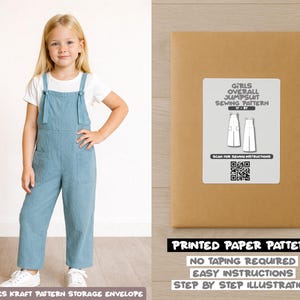 May include: A young girl in a light blue jumpsuit with front pockets and white trainers. A brown paper envelope displays a label reading "GIRLS OVERALL JUMPSUIT SEWING PATTERN". The text "PRINTED PAPER PATTERN" is also visible.