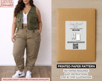 May include: An olive green cargo pocket vest and khaki cargo pants are modeled. A printed paper pattern in a kraft paper envelope is displayed, with text that reads "Cargo Pocket Vest Sewing Pattern". The pattern includes easy instructions.
