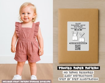 May include: A toddler wearing a dusty rose-colored romper with ruffled straps and a square neckline. The image also shows a kraft paper envelope with a label that reads "BABY SQUARE NECK ROMPER SEWING PATTERN". The text "PRINTED PAPER PATTERN" is also visible.