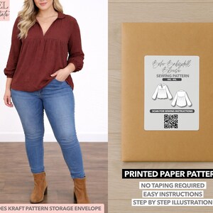 May include: A woman wearing a burgundy blouse and blue jeans. Next to her is a brown paper pattern envelope with a white label that reads "Boho Babydoll Blouse Sewing Pattern." The envelope also states "Printed Paper Pattern" and "No Taping Required."
