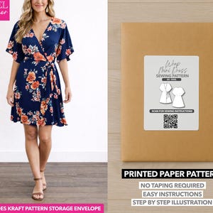 May include: A woman wearing a navy blue wrap mini dress with orange and white floral print. The image also shows a brown paper pattern envelope with a white label that reads "Wrap Mini Dress Sewing Pattern". The text "Printed Paper Pattern" is also visible.