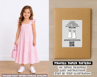 May include: A light pink sleeveless maxi dress with a shirred bodice and ruffled straps, paired with a matching mini tote bag. Beside it, a brown kraft envelope displays a label titled Girls Shirred Maxi Dress Sewing Pattern with a QR code.