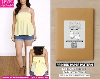 May include: A woman wearing a yellow babydoll top with spaghetti straps and denim shorts. A brown paper pattern envelope with a label that reads "Bow Back Babydoll Top Sewing Pattern" is also shown. The pattern includes a kraft pattern storage envelope.