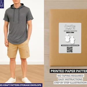 May include: A person wearing a gray hooded short-sleeve shirt and khaki shorts. A brown paper pattern envelope with a white label that reads "Drawstring Hooded Tee Sewing Pattern" is also in the image. The pattern includes easy instructions.