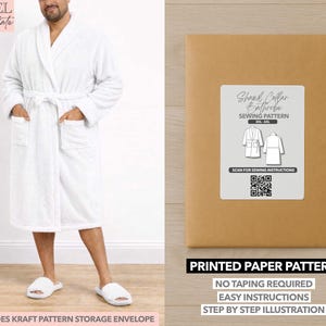May include: A white terry cloth bathrobe with a shawl collar, pockets, and a matching belt. The image also shows a sewing pattern for a shawl collar bathrobe, with text that reads "Printed Paper Pattern" and "Easy Instructions."