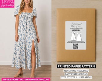 May include: A woman wearing a white maxi dress with a blue floral pattern and a high slit. The image also shows a brown paper pattern envelope with a label that reads "Milkmaid Maxi Dress Sewing Pattern". The text "Printed Paper Pattern" is also visible.