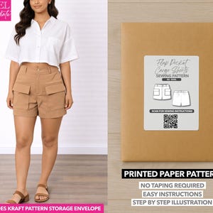 May include: A woman wearing a white button-down shirt and tan cargo shorts. A brown paper pattern envelope with a label that reads "Flap Pocket Cargo Shorts Sewing Pattern" is on the right. The text "Printed Paper Pattern" is below the label.
