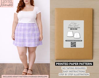 May include: A-line mini skirt sewing pattern in a kraft paper envelope. The pattern includes easy instructions and step-by-step illustrations. The model is wearing a white top and a purple plaid skirt. The pattern is for sizes 6XL-4XL.