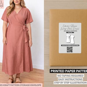 May include: A woman wearing a dusty rose wrap maxi dress with short sleeves and a tie waist. Next to the woman is a brown paper pattern envelope with a label that reads "Kimono Sleeve Wrap Maxi Dress Sewing Pattern". The pattern includes a kraft pattern storage envelope.