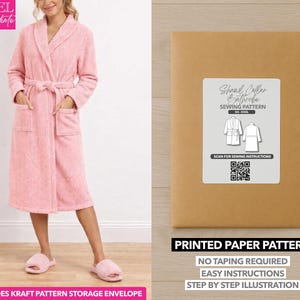 May include: A pink terry cloth robe with a shawl collar, pockets, and a belt. The image also shows a brown paper envelope with a sewing pattern label that reads "Shawl Collar Bathrobe Sewing Pattern". The text "Printed Paper Pattern" is also visible.