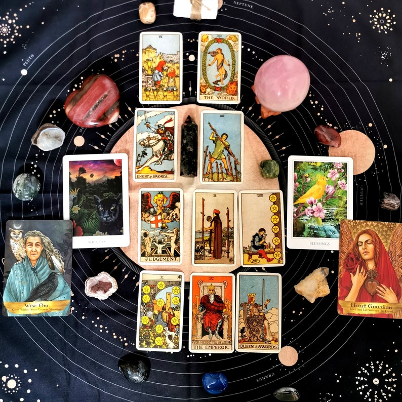 May include: Tarot card spread on a black background with crystals and stones. The cards include The World, Judgement, Knight of Swords, The Emperor, Queen of Swords, and Blessing. The text on the cards includes "The World", "Judgement", "Knight of Swords", "The Emperor", "Queen of Swords", and "Blessing".