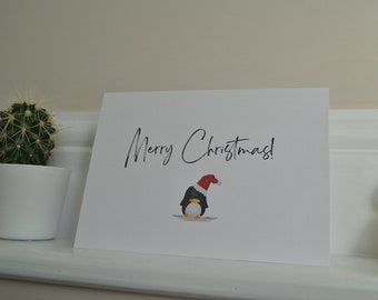 Christmas Card with festive penguin