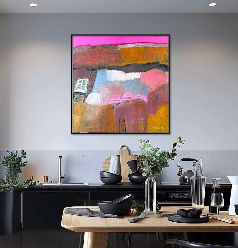 May include: Abstract landscape painting in a black frame. The artwork features a vibrant color palette with pink, orange, blue, and brown hues. The composition includes textured brushstrokes and a dynamic interplay of shapes, evoking a sense of depth and movement.
