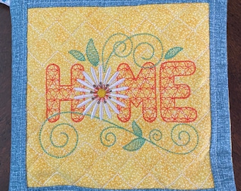 Daisy Home Potholder/Trivet.  Approximately 8 inches square.  Quilted and Embroidered