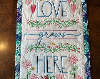 Wall Hanging, Love Grows Here.  2 sizes and color variations.  Quilted and Embroidered