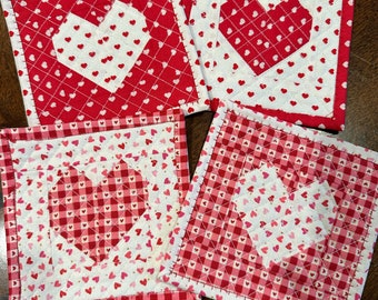 Valentines Coaster/Mug Rug.  Quilted hearts in 4 color combinations and fabrics.  Approximately 5 1/2 " square