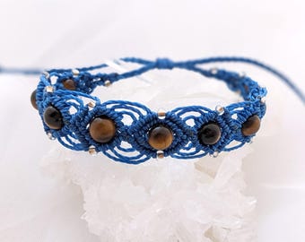 Blue Linhasita macrame bracelet with natural tiger's eye gemstone beads. Unique handcrafted creation, boho gift for women.