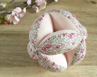 Montessori gripping ball in Liberty Eloïse classic and powder pink diaper