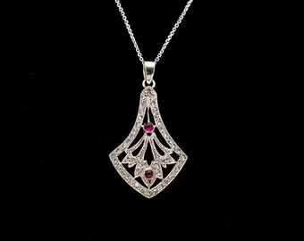 Antique pendant with diamonds and tourmalines.
