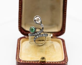 Art Nouveau ring with emerald and diamonds, circa 1900.