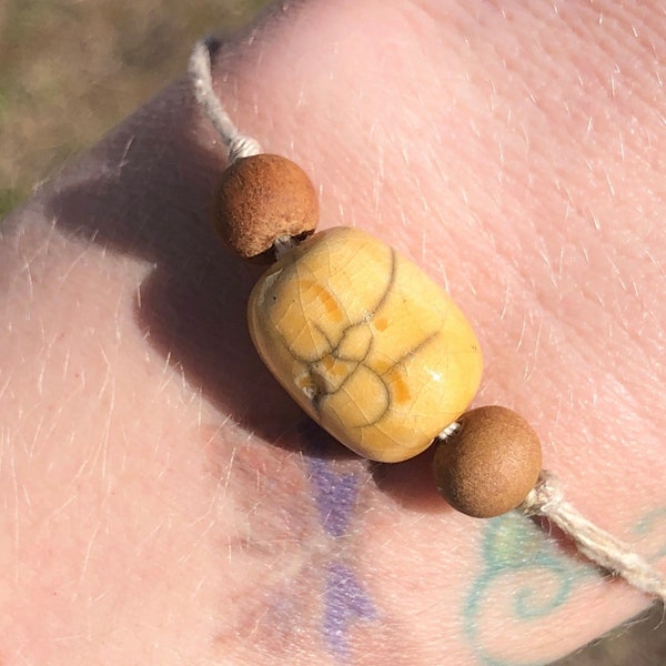 Jizo yellow bead raku talisman bracelet with sandalwood & adjustable eco hemp | Shinto jewellery, protection, grief, loss, bereavement gift