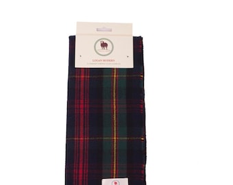 May include: A tartan scarf in navy, red, green, and yellow. The scarf has a fringed edge and a tag at the top with the text "LOGAN MODERN". A small label is attached near the bottom. The scarf is approximately 170 cm long.