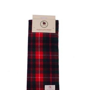May include: A Fraser of Lovat Modern tartan scarf in a classic plaid pattern. The scarf features a red, green, and black color scheme with fringed ends. The scarf has a tag with the brand name and logo.