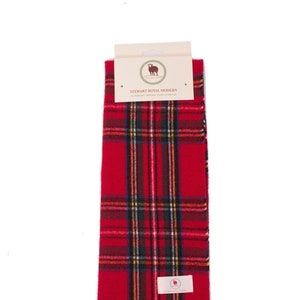 May include: Red and black tartan scarf with fringe. The scarf has a label that reads "Stewart Royal Modern" and a small image of a sheep.