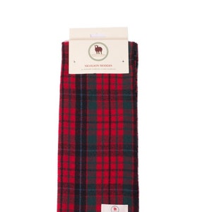 May include: Red, green, and black plaid scarf with fringe. The scarf has a label that reads "Nicolson Modern Pure New Tartan Clan Scarf".