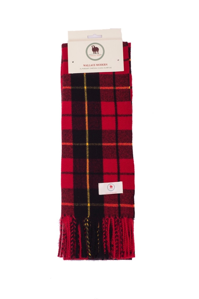 May include: Red, black, and yellow plaid scarf with fringe. The scarf has a label that reads "Wallace Modern Superfine Scottish Clan Scarf".