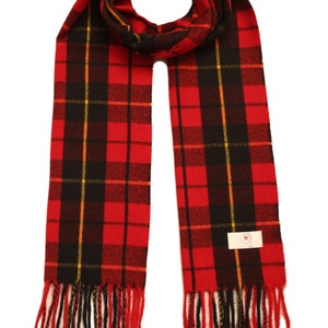 May include: Red, black, and yellow plaid scarf with fringe. The scarf has a small white tag with a red logo.