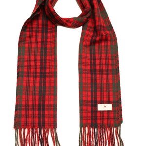 May include: Red, green, and black plaid scarf with fringed ends.