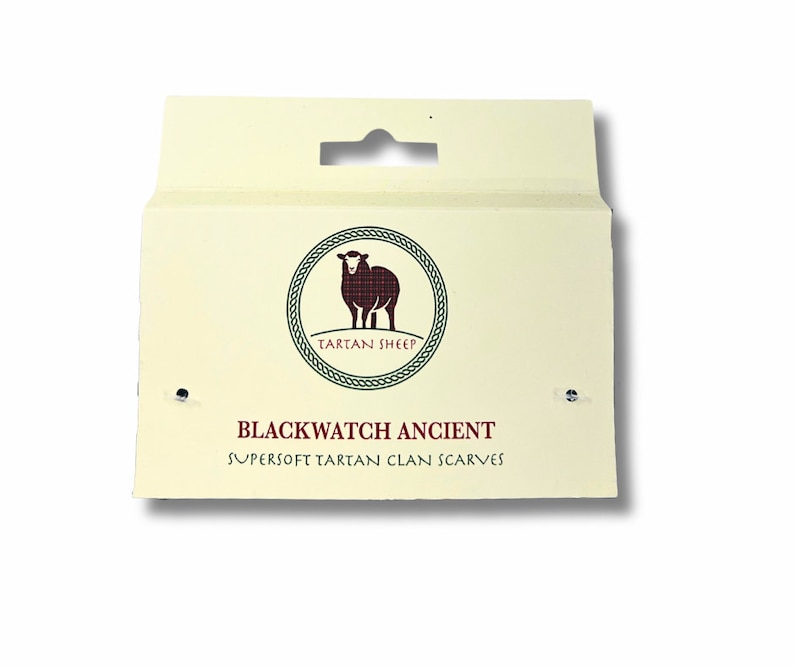 May include: A cream-colored packaging label with a black sheep logo and the text "Tartan Sheep". The label also includes the text "Blackwatch Ancient Supersoft Tartan Clan Scarves".