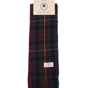 May include: A Fraser Hunting Modern tartan scarf in green, burgundy, and white. The scarf has a fringed edge and a tag with the brand name and logo. The scarf is approximately 152 cm long.