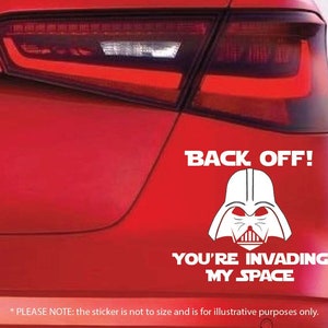 May include: A white vinyl sticker with a black and white illustration of Darth Vader's helmet. The sticker reads "Back Off! You're invading my space."