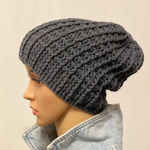 Wool hat handmade unisex. Crocheted women&#39;s hat made of merino wool. Hand-knitted winter hat with an attractive pattern. Knitted hat in anthracite