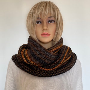 Knitted scarf merino wool colorful. Loop knitted with stripes. Scarf hand knitted for men and women. Black knitted wool scarf. Round scarf