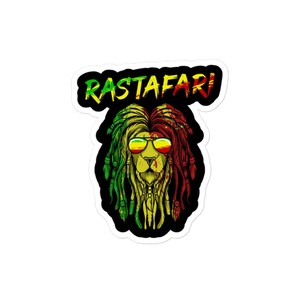 May include: A lion with dreadlocks in the colors of the Rastafarian flag, green, yellow, and red, wearing sunglasses and the word "Rastafari" above it.