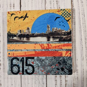 May include: A colorful square tile with a collage of images. The top half features a blue circle with a cityscape silhouette and flying birds. The bottom half features a map with the number 615 in black.