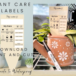 May include: Plant care labels with space to write plant names and care instructions. The labels include sections for shade, light, soil moisture, and feeding schedules. A terracotta watering can with white flower designs holds a plant with a label. A dry erase marker is visible.