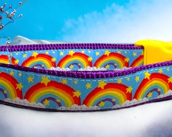 May include: A purple and blue dog collar with a rainbow and star pattern. The collar has a yellow plastic buckle.