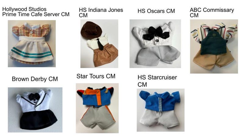 May include: Collection of miniature doll outfits, including a server uniform with a white and teal skirt, an Indiana Jones-inspired ensemble with a brown hat, and a Star Tours costume with blue and orange accents. Each outfit is designed with detailed miniature tailoring.