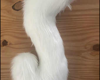 Curled long white fursuit tail