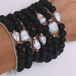 Maui shell bracelet with Lava Rock beads from Philippines. String on durable 1mm stretchy cord.