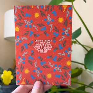 May include: A red card with a floral pattern and the text "OH GIVE THANKS TO THE LORD. FOR HE IS GOOD. FOR HIS STEADFAST LOVE ENDURES FOREVER! PSALM 18:29"