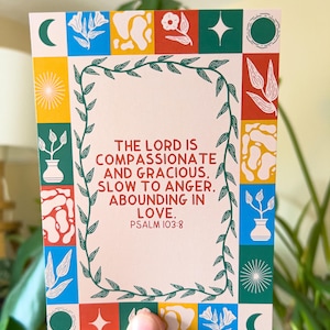 May include: A colorful card with a green vine border and a quote from Psalm 103:8. The quote reads "The Lord is compassionate and gracious, slow to anger, abounding in love."